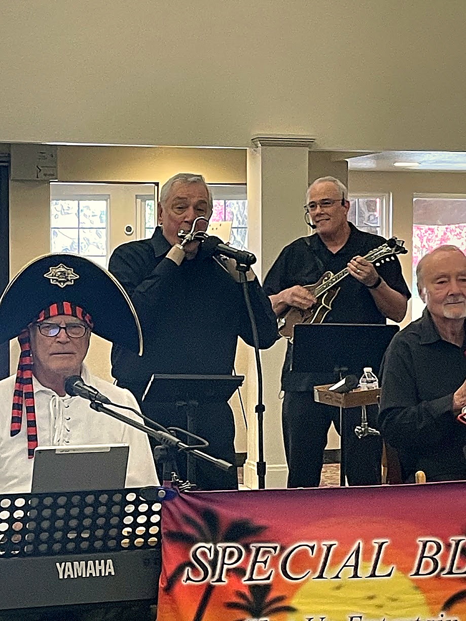 David on keys, Paul on harmonica, and Dan on mandolin